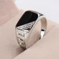 Macro detail shot of a silver men's ring with black enamel inlay and small stones - US 6 / Silver