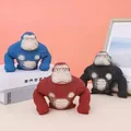 Variety of squeezable gorilla stress-relief toys shown in blue, red, and black colors - 720g Colored Gorilla 15*15cm OPP Bag Packaging