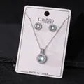 Round halo zircon necklace and stud earrings set in silver finish - Haze Blue