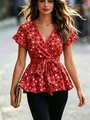 Detail of women's red floral print V-neck top with ruffled sleeves and tie-waist - S / Red