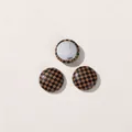 Detail view of small round buttons with brown and black checkered pattern and silver back - Round Coffee Checkerboard (D02-5-1-7)