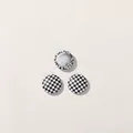Close-up of round black and white checkerboard DIY buttons with silver metal back - Round Black White Checkerboard (D02-5-1-7)