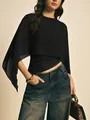 Elegante zwarte chiffon top met poncomouwen en onregelmatige zoom met ronde hals - S / Zwart
