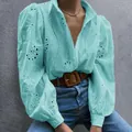 Stylish turquoise puff sleeve blouse featuring intricate hollow-out eyelet embroidery - S / Light Blue