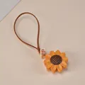 Handcrafted wooden sunflower keychain charm with brown cord and lucky tag - Sunflower Charm