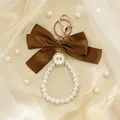 Detailed macro shot of an elegant brown ribbon bow and pearl bead wristlet keychain gift - Brown Bow (ZJ17030)