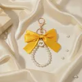 Elegant large yellow ribbon bow keychain with pearl loop and gold-tone clasp charm - Yellow Bow (ZJ17025)
