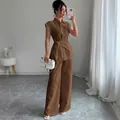Elegant brown two-piece set featuring short-sleeved tie-waist shirt and wide-leg trousers - S / Brown