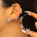 Dettaglio macro di orecchini a clip con cavalluccio marino e stella marina in argento. - Stile Stella Marina (Coppia) / Oro