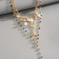 Macro shot of multilayer gold necklace featuring resin conch, starfish, and colored beads - Multicolor Style / Four-Piece Set / Gold