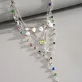 Macro view of 4-piece necklace set featuring starfish, sea shell, pearls, and colorful beads - Multicolor Style / Four-Piece Set / Silver