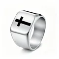 Detailed macro view of punk hip-hop stainless steel signet ring with black cross design for men - Size 6 / Silver