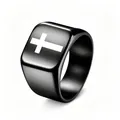 Close-up of a black punk signet ring featuring a bold white cross design for men - Size 6 / Black