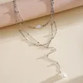 Detailed view of silver-tone multi-layered pearl necklace with Y-shape lariat drop - Three-Piece Set / Silver