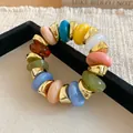 Detailed macro view of colorful geometric resin beads on a chunky retro elastic bracelet - Multicolor Geometric Beaded Style (62#手链) / Gold-Multicolor