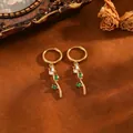 Detailed macro shot of exquisite tulip earrings featuring green leaves and white marquise stones - Tulip Flower Earrings (T079) / Gold with White Zircon