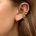 Detail shot of a copper-inlaid zircon cross ear cuff on a female ear, elegant gold finish - Cross Ear Cuff (2505) / Gold