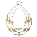 Detail view of a sophisticated three-layer beaded necklace featuring square amber marbled beads - Light Brown