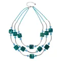 Detail view of a 3-layer teal square resin bead necklace with blue accents - Dark Green