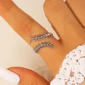 Detailed macro view of a silver gothic centipede shaped open ring worn on a finger - Centipede Ring (X279) / Silver