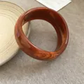 Elegante bracciale rigido in acrilico marmorizzato ambra con design circolare minimalista - Stile 56 - Arancione
