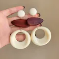 Detailed macro shot of vintage French style hollow wood and resin dangle earrings - Geometric Round Patchwork Style (10#)