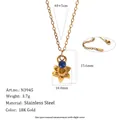 Macro view of 18K gold plated stainless steel narcissus flower pendant with blue stone - March Narcissus (N3945_Gold_3) / 18K Gold