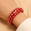 Fashionable chunky red resin bangle bracelet featuring silver punk-style metal rivets - Bracelet (2643) / Red
