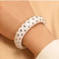 Stylish white resin bangle with silver rivet studs in punk fashion style for women. - Bracelet (11714) / White