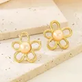 Elegant 18K gold plated stainless steel flower stud earrings with a central pearl - Hollow Pearl Five-Petal Flower (KE115786-GC)