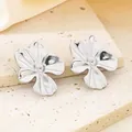 Elegant textured silver flower petal stud earrings with a minimalist organic design - Wrinkled Five-Petal Flower (KE113881-KFC)
