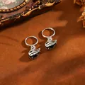 Eleganti orecchini a cerchio argentati con ciondoli cigno nero e zirconi - Orecchini A Cigno T064 In Argento E Diamanti Neri