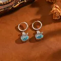 Orecchini a cerchio a cigno con occhio di gatto blu e zirconi incastonati - Orecchini Cigno Zirconia Blu Argento