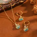 Elegante set gioielli a cigno con pietre occhio di gatto blu, include collana e orecchini. - Set Cigno T064 In Oro E Diamanti Blu