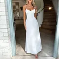 Elegant white corset maxi dress featuring an A-line skirt and delicate thin shoulder straps - S / White
