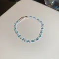 Elegante bracciale a fiori in zircone blu e bianco con una chiusura a scatto sicura - Argento-Blu Bianco Floreale