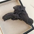 Close-up of a French vintage black hair claw clip with white polka dots - Standard Quality (No. 2) / Black Polka Dot