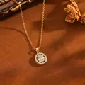 Close-up of gold stainless steel necklace with round sparkling zircon pendant - Oval Locket / Gold