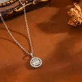Close-up detail of a sparkling round pendant necklace with baguette and round cut stones - Round Pendant / Silver