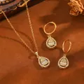 Elegant teardrop rhinestone necklace and earrings jewelry set with vintage props - Waterdrop Jewelry Set / Gold
