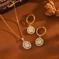 Close-up of French style oval gold pendant necklace and hoop earring set with stones. - Oval Set / Gold
