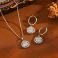 Close-up of French style rhinestone pendant necklace and earrings set on vintage background - Round Set / Silver