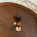 Retro ethnic style necklace featuring a wooden hat pendant and natural seed beads - Semi-circular Hat Beaded Style (7#)