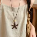 Vintage starfish pendant necklace with brown resin wood texture and thin cord. - Starfish Shape - Dark Coffee