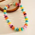 Detail of colorful marbled acrylic bead necklace with retro aesthetic and vibrant hues. - Necklace / Colorful