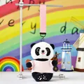 Close-up of a cute panda plush keychain wearing a pink shirt in a rainbow setting - Pink