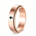 Detail view of a rose gold stainless steel spinner ring with a black cross design. - Rose Gold