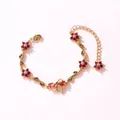 Bracelet élégant en or avec des fleurs en zircon rouge rubis et un charmant nœud en feuilles - Style Horizontal-Or-Zirconia Rouge Rose