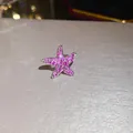 Macro detail of a sparkling pink zircon starfish ear cuff with no piercing design - Zirconia Starfish Ear Cuff (HE34044) / Rose Red Starfish Style