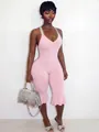 Close-up of pink slim-fit jumpsuit with ruffled hems and V-neckline for summer - S / Pink